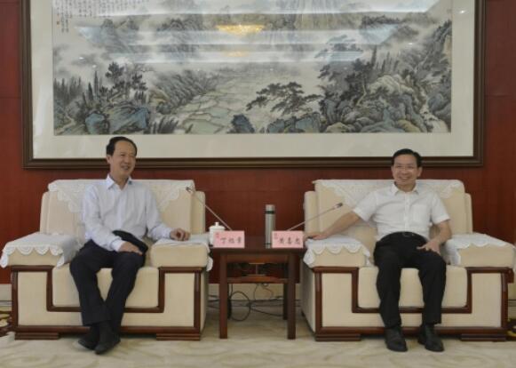 丁焰章拜會南昌市委副書記、市長黃喜忠